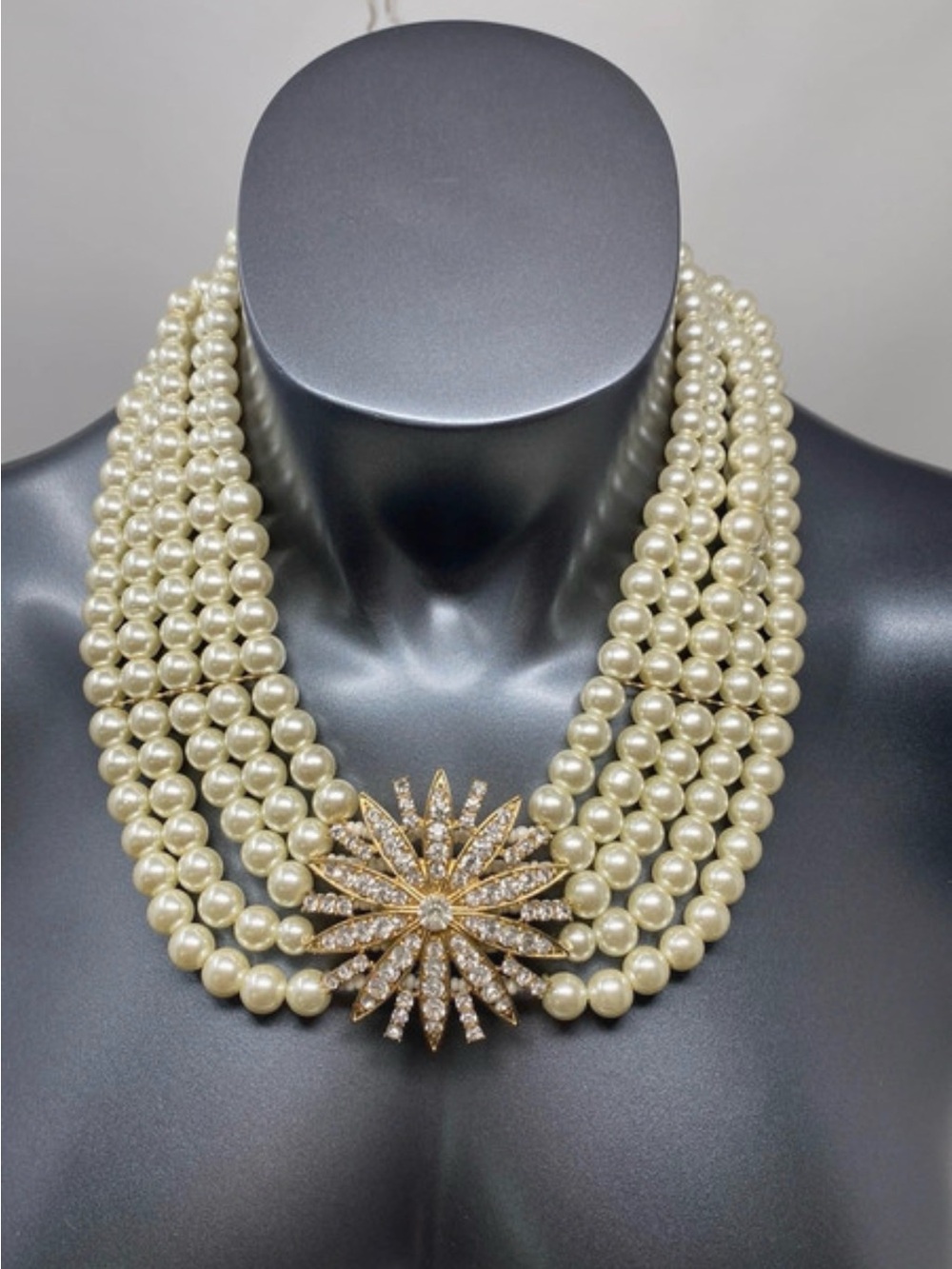 Elegant Cream Multi-Strand Pearl Necklace with Gold Starburst Clasp